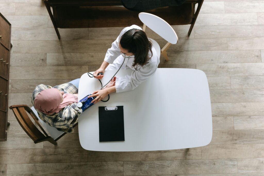 Overhead view of a doctor checking a patient