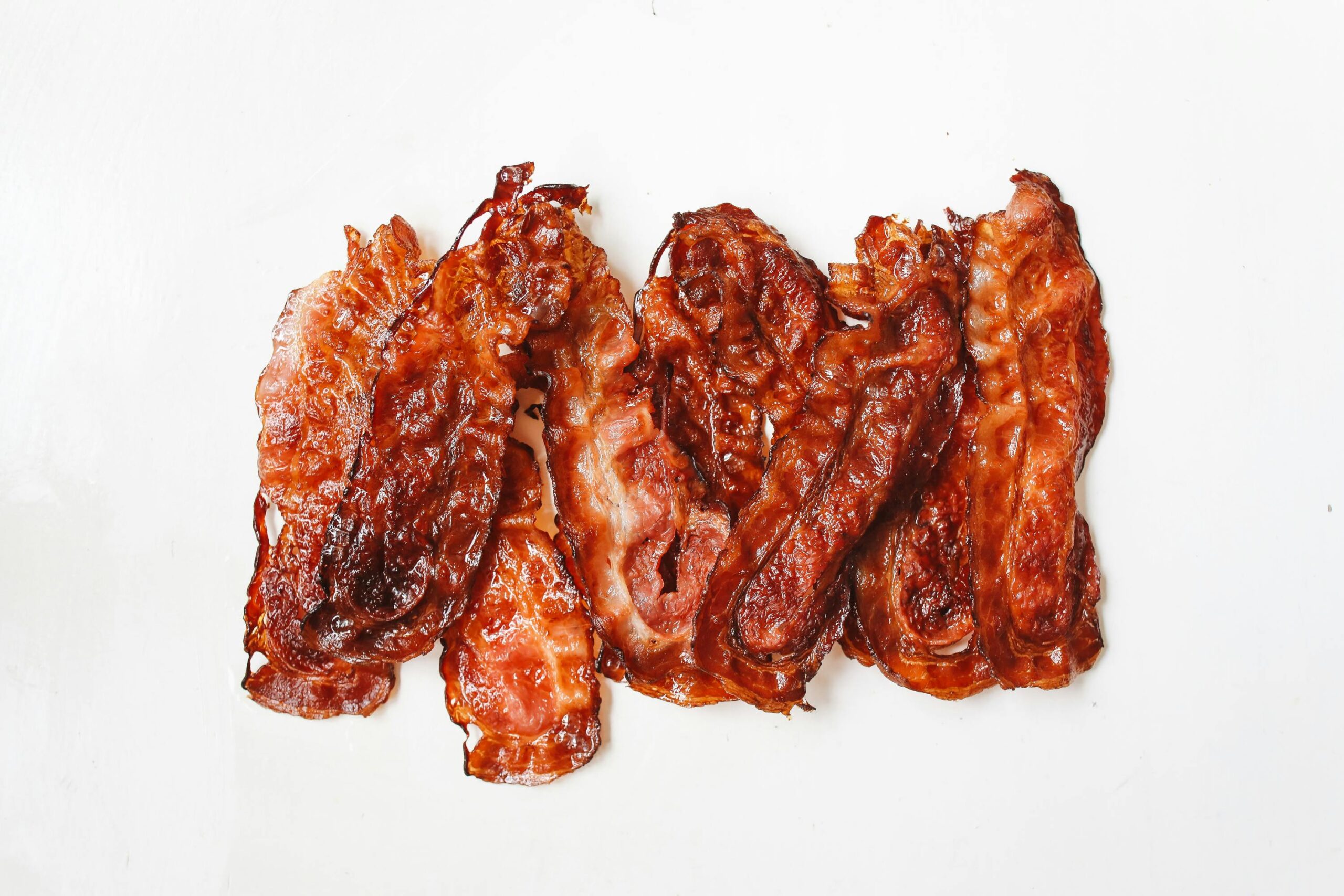 A tempting display of crispy bacon strips, perfect for breakfast or a savory treat.