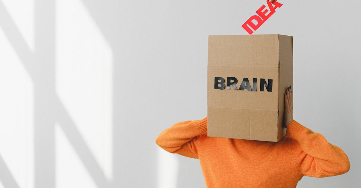 Surreal image of a person with a cardboard brain, symbolizing idea and intellect.